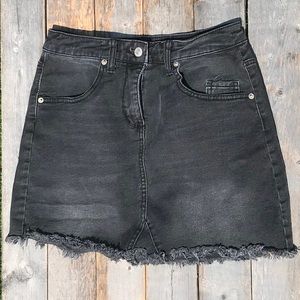 Black denim skirt.